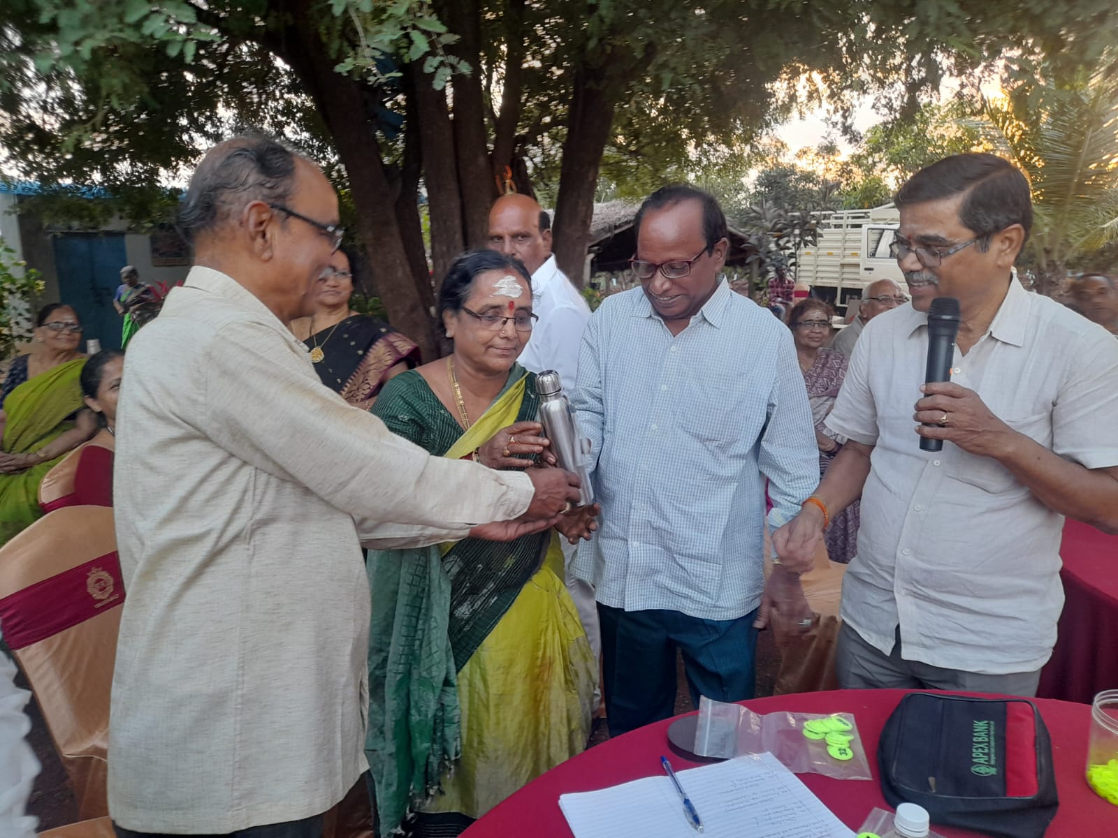 Smt. Swarna Kumari  W/O Madhusudhan Rao Garu receiving Second prize in Singing compitition (Women) in get-together party on 22-11-2023.